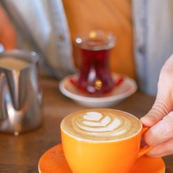 Waitress offering a cup of coffee